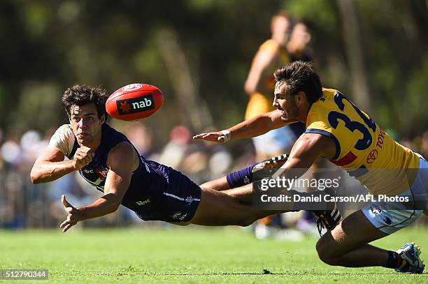 Brady Grey of the Dockers handballs during the 2016 NAB Challenge match between Fremantle Dockers and the Adelaide Crows at Sounness Park, Mount...