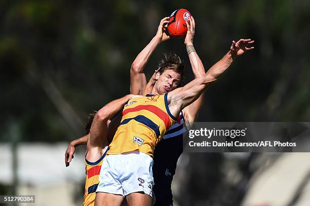 Sam Shaw of the Crows misses the spoil on a mark taken by Matt Taberner of the Dockers during the 2016 NAB Challenge match between Fremantle Dockers...