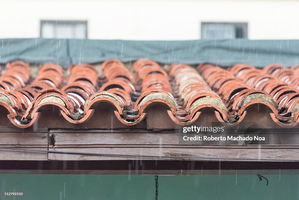 Colonial clay tiled roof in vintage home detail. Clay tile...