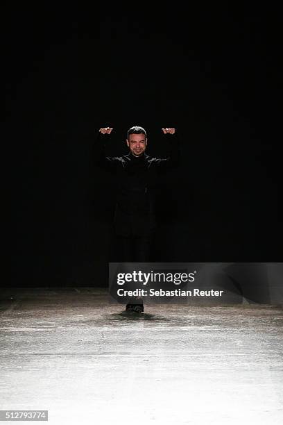 Designer Alberto Zambelli acknowledges the applause of the audience at the Alberto Zambelli show during Milan Fashion Week Fall/Winter 2016/17 on...