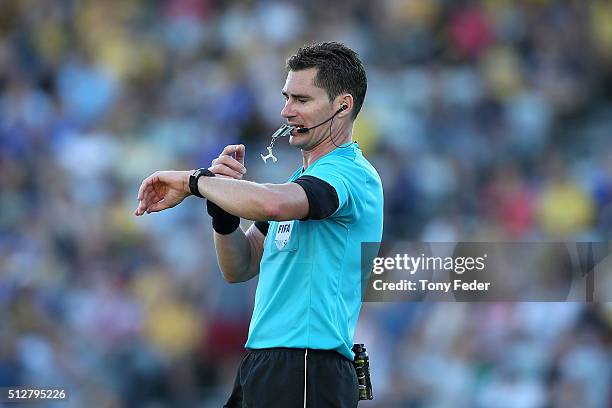 Referee Ben Williams checks his watch during the round 21 A-League match between the Central Coast Mariners and the Newcastle Jets at Central Coast...