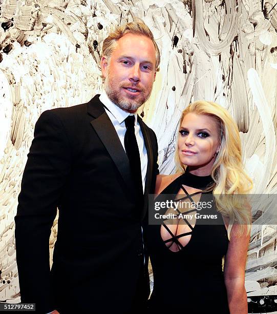Eric Johnson and Jessica Simpson attend the "Tom Everhart "Raw" Exhibition of His Schulz-influenced Paintings For The First Time In Black And White...