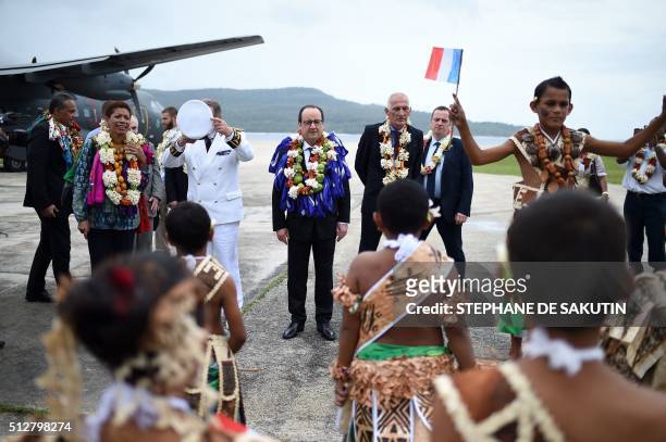 French President Francois Hollande and French Overseas Territories Minister George Pau-Langevin attend a ceremony in Futuna island, on February 22 in...