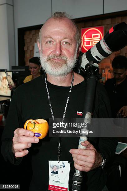 Photographer Dan Lecca Drinks a Damrak and Cointreau signature cocktail dressed in a Sunkist Orange during the Olympus Fashion Week Spring 2005...