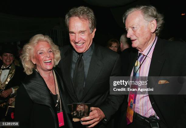 Actor Warren Beatty chats with Kenneth Thomson and wife Marilyn at the opening night party of the 2004 Toronto International Film Festival on...