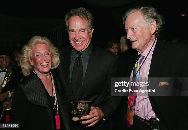 Actor Warren Beatty chats with Kenneth Thomson and wife Marilyn at the opening night party of the 2004 Toronto International Film Festival on...