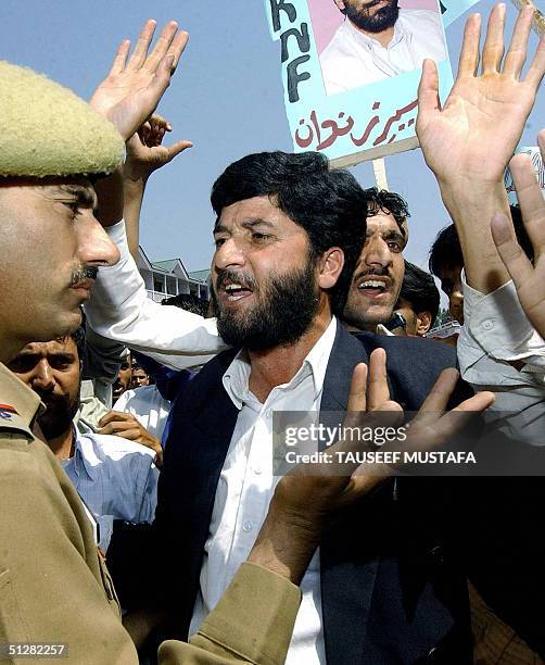 Activists of the Jammu and Kashmir National Front scuffle with Indian police while shouting anti-Indian slogans to demand the release of separatist...