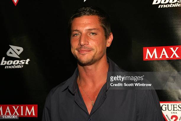 Actor Simon Rex poses at Maxim Magazine's Music Issue Party during Olympus Fashion Week Spring 2005 on September 9, 2004 at Crobar, in New York City.
