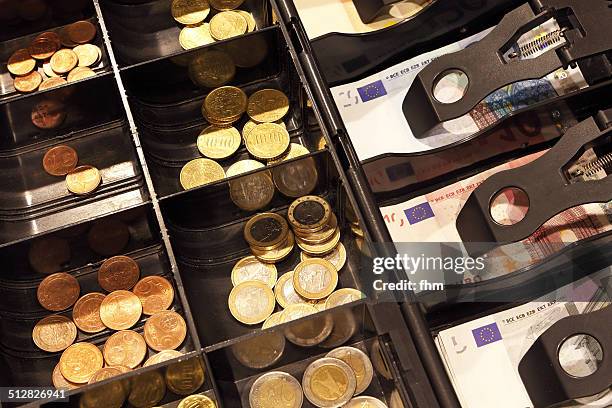 money in a cashbox - plentiful imagens e fotografias de stock