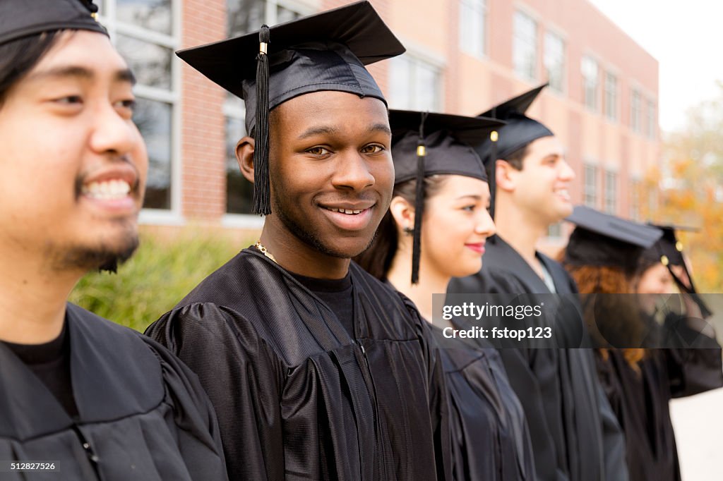 Education: African descent male graduate and friends on college campus.