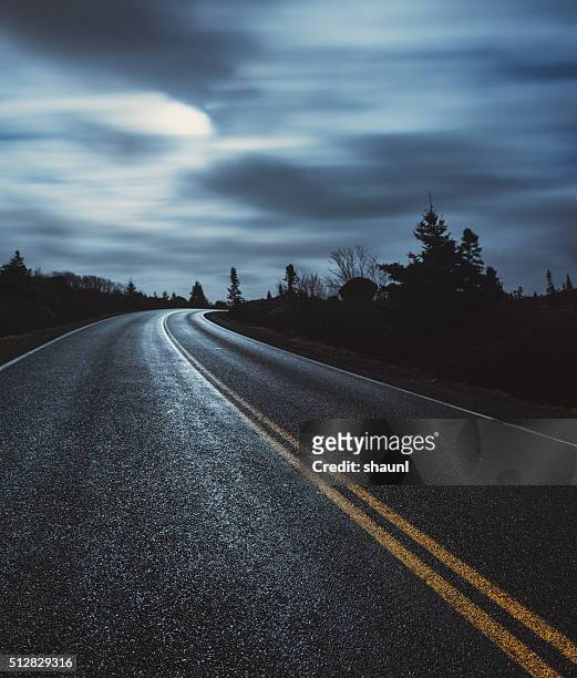 moonlit coastal road - wet asphalt stock pictures, royalty-free photos & images