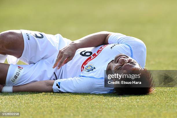 Kazuki Ganaha of Kamatamare Sanuki reacts to an injury during the J.League second division match between Yokohama FC and Kamatamare Sanuki at the...