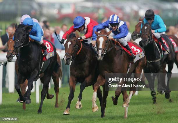 Etlaala ridden by Richard Hills beats Iceman ridden by Kieron Fallon and Oude ridden by Frankie Dettori to win the SGB Champagne Stakes at Doncaster...