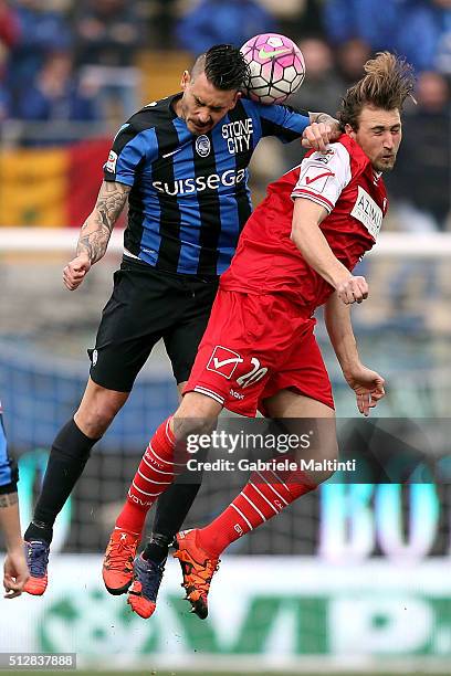 Lorenzo Lollo of Carpi FC battles for the ball with Mauricio Pinilla of Atalanta BC during the Serie A match between Carpi FC and Atalanta BC at...