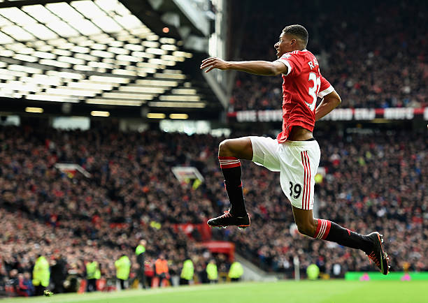 Marcus Rashford of Manchester United celebrates scoring his opening goal during the Barclays Premier League match between Manchester United and...