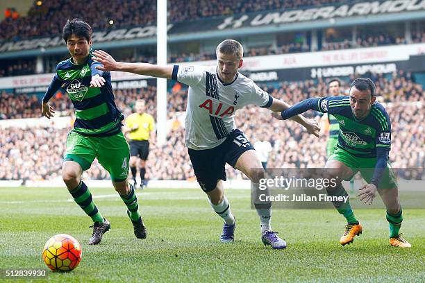 Eric Dier of Tottenham Hotspur is closed down by Ki Sung-Yeung and Leon Britton of Swansea City during the Barclays Premier League match between...