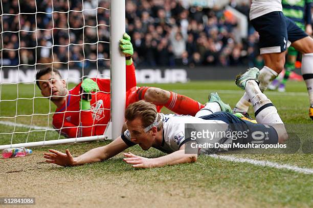 Harry Kane of Tottenham Hotspur goes to ground after failing to score during the Barclays Premier League match between Tottenham Hotspur and Swansea...