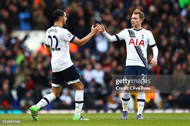 Nacer Chadli of Tottenham Hotspur celebrates scoring his goal with Christian Eriksen during the Barclays Premier League match between Tottenham...