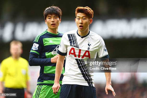 Son Heung-Min of Tottenham Hotspur and Ki Sung-Yeung of Swansea City look on during the Barclays Premier League match between Tottenham Hotspur and...