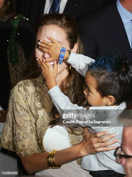 Actress Angelina Jolie and her son Maddox attend the World Premiere of "Shark Tale" in San Marco Square, as part of the 61st Venice Film Festival on...