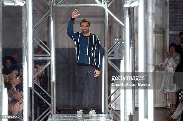 Designer Massimo Giorgetti ackowledges the applause of the audience at the end of MSGM show during Milan Fashion Week Fall/Winter 2016/17 on February...