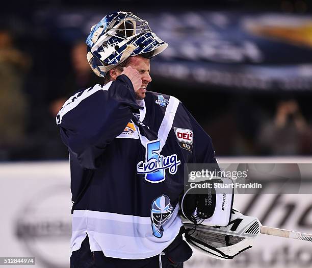 Dimitrij Kotschnew of Hamburg wipes away tears during the Bundesliga ice hockey match between Hamburg Freezers and Adler Mannheim at Barclaycard...