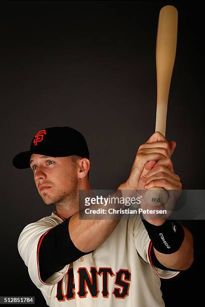 Buster Posey of the San Francisco Giants poses for a portrait during spring training photo day at Scottsdale Stadium on February 28, 2016 in...