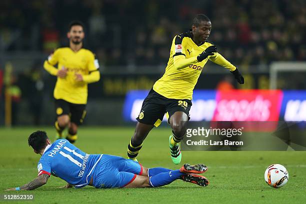 Adrian Ramos of Borussia Dortmund evades the tackle from Jiloan Hamad of 1899 Hoffenheim during the Bundesliga match between Borussia Dortmund and...