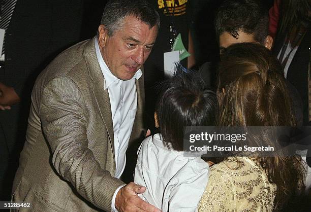 Actor Robert De Niro with actress Angelina Jolie and her son Maddox at the World Premiere of "Shark Tale" in San Marco Square, as part of the 61st...