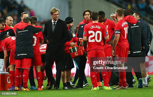 Jurgen Klopp, manager of Liverpool talks to his players during the extra time break during the Capital One Cup Final match between Liverpool and...