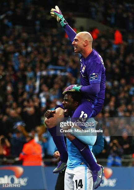 Wilfred Bony lifts goalkeeping hero Willy Caballero of Manchester City in celebration after the Capital One Cup Final match between Liverpool and...