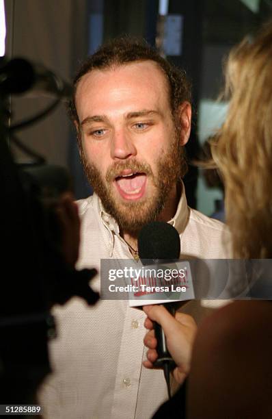 Fashion designer Frazer Harmon is interviewed backstage at the Harmon show during Olympus Fashion Week Spring 2005 at Niccolo September 10, 2004 in...