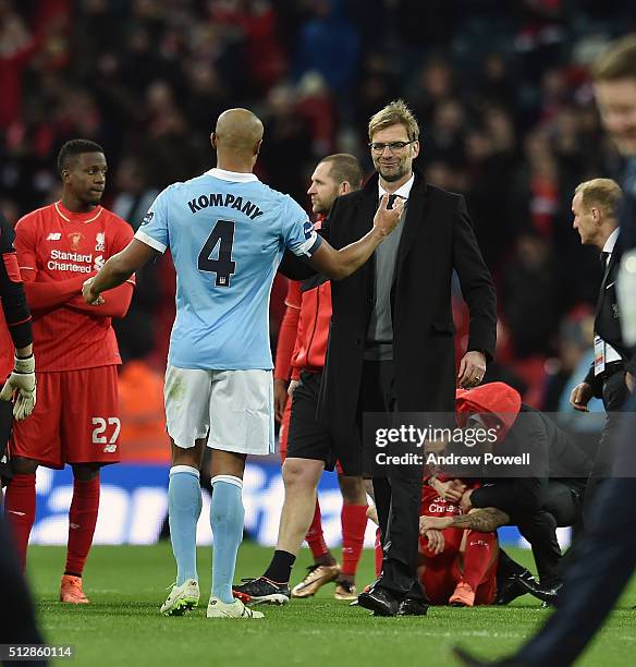 Jurgen Klopp manager of Liverpool shakes hands with Vincent Kompany of Manchester City at the end of the Capital One Cup Final match between...