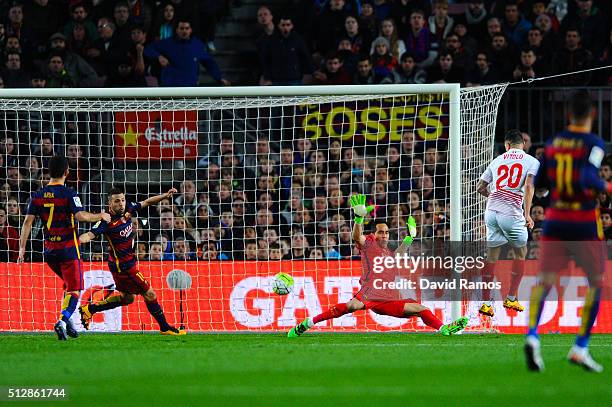 Victor Machin 'Vitolo' of Sevilla FC scores the opening goal past Claudio Bravo of FC Barcelona during the La Liga match between FC Barcelona and...