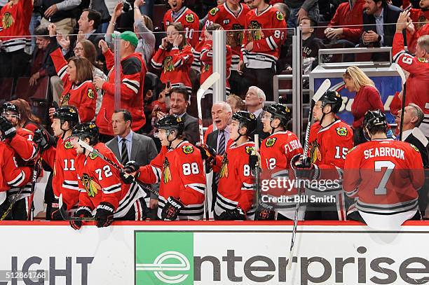 Joel Quenneville, head coach of the Chicago Blackhawks, reacts after the Blackhawks scored in the third period of the NHL game against the Washington...