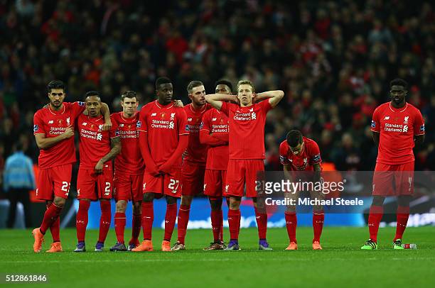 Liverpool players look despondent in the penalty shoot out during the Capital One Cup Final match between Liverpool and Manchester City at Wembley...