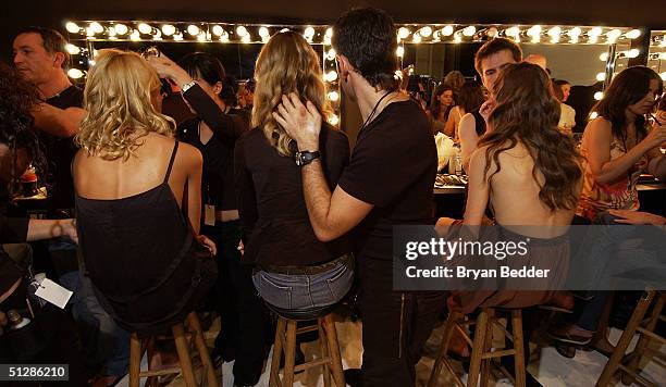 Models get their hair done backstage at the Matthew Williamson Spring 2005 collection show during the Olympus Fashion Week in Splash Light Studios...