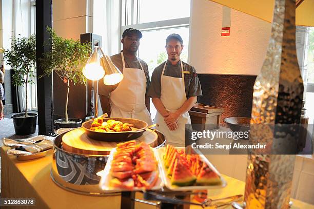 Chefs pose with prepared food at the Southern Kitchen Brunch Hosted By Trisha Yearwood - Part of The NYT Cooking Series during 2016 Food Network &...