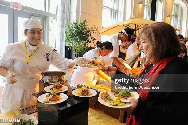 Guest enjoys food prepared at the Southern Kitchen Brunch Hosted By Trisha Yearwood - Part of The NYT Cooking Series during 2016 Food Network &...
