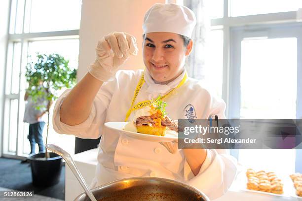 Chef prepares dish at the Southern Kitchen Brunch Hosted By Trisha Yearwood - Part of The NYT Cooking Series during 2016 Food Network & Cooking...