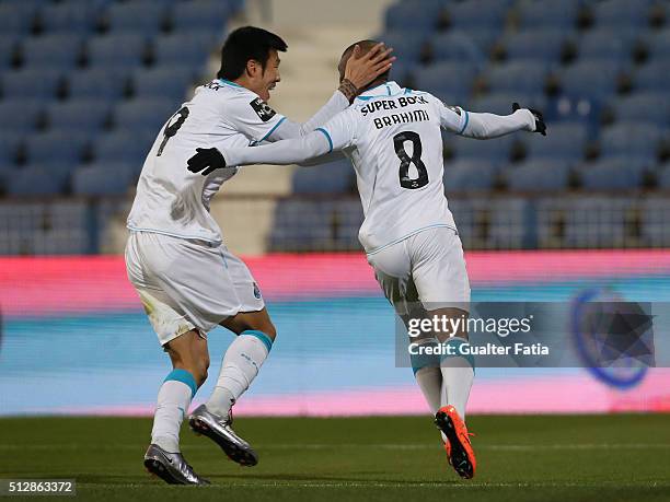 Porto's forward Yacine Brahimi celebrates with teammate FC Porto's forward from South Korea Suk Hyun-Jun after scoring a goal during the Primeira...