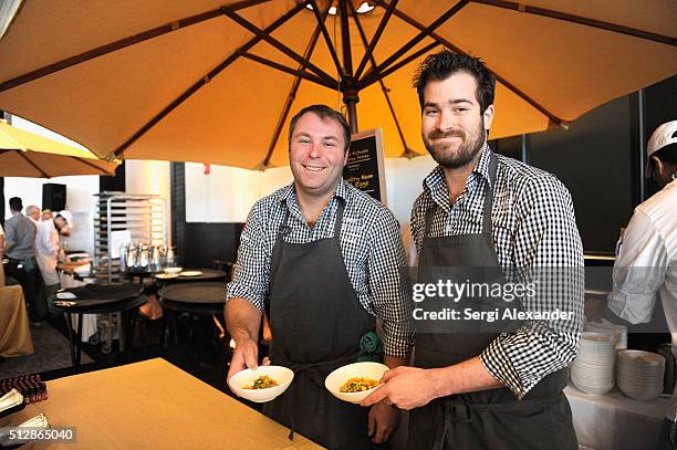 Michael Fojtasek and Grae Nonas preparing food during the Southern Kitchen Brunch Hosted By Trisha Yearwood - Part of The NYT Cooking Series during...