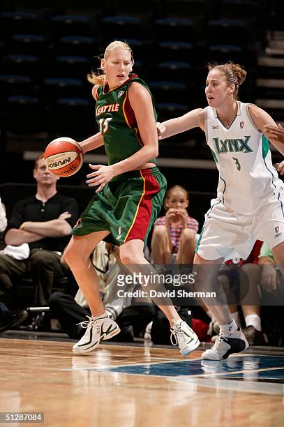 Lauren Jackson dribbles against Nicole Ohlde of the Seattle Storm of the Minnesota Lynx on September 10, 2004 at the Target Center in Minneapolis,...