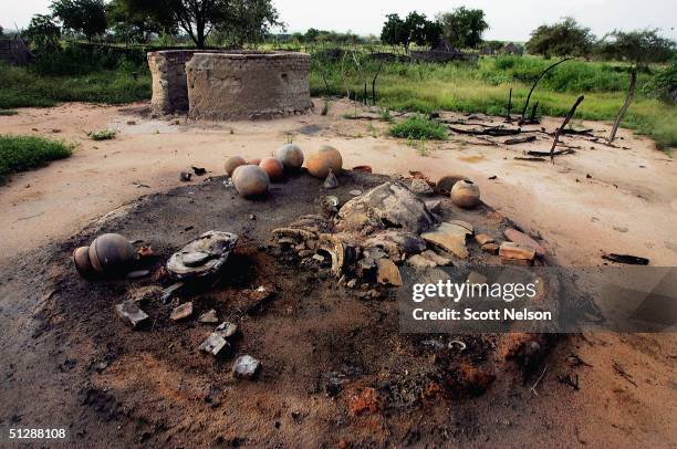 The smouldering remains of the village of Chero Kasi are seen here September 8 a day after it was set ablaze by Janjaweed militiamen in the violence...