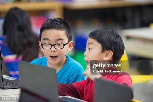 playing an educational game together - filipina stock pictures, royalty-free photos & images