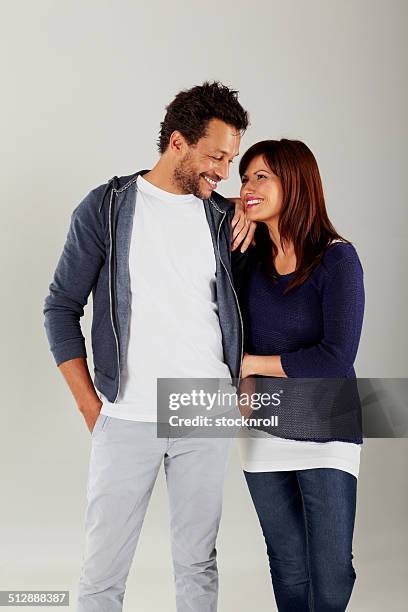 lovely mixed race couple together - mixed race man standing studio stockfoto's en -beelden