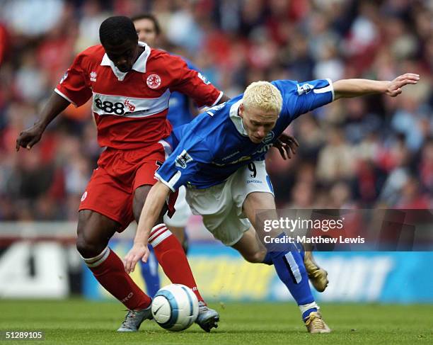 George Boateng of Middlesbrough tackles Mikael Forssell of Birmingham during the Barclays Premiership match at The Riverside Stadium on September 11,...