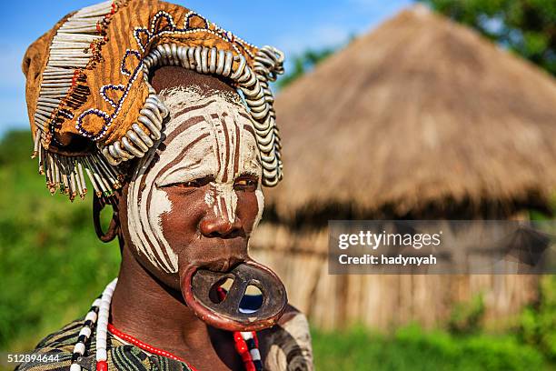 portrait of woman from mursi tribe, ethiopia, africa - mursi tribe stock pictures, royalty-free photos & images