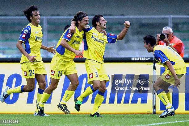 Sergio Pellissier of Chievo celebrates a goal with team-mates Daniele Franceschini, Federico Cossato and Franco Semioli during the Serie A match...