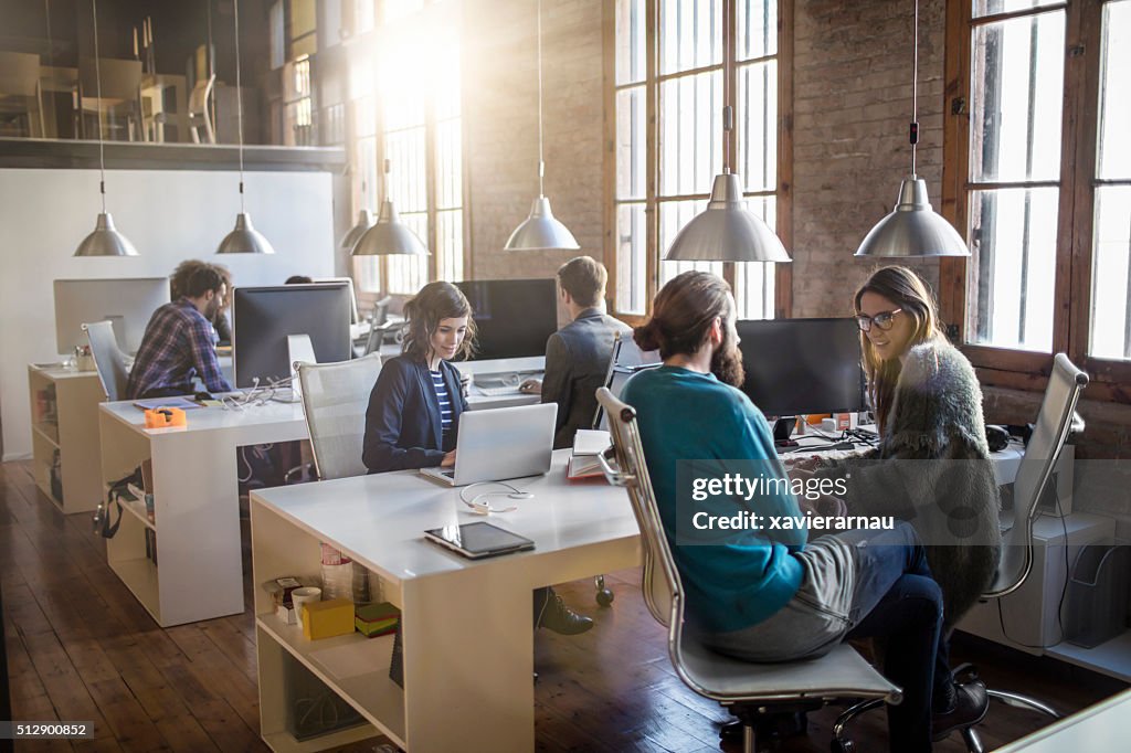 Young creative business people working in the office